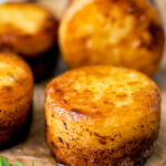 Fondant potatoes poached in butter and stock with a sprig of thyme.