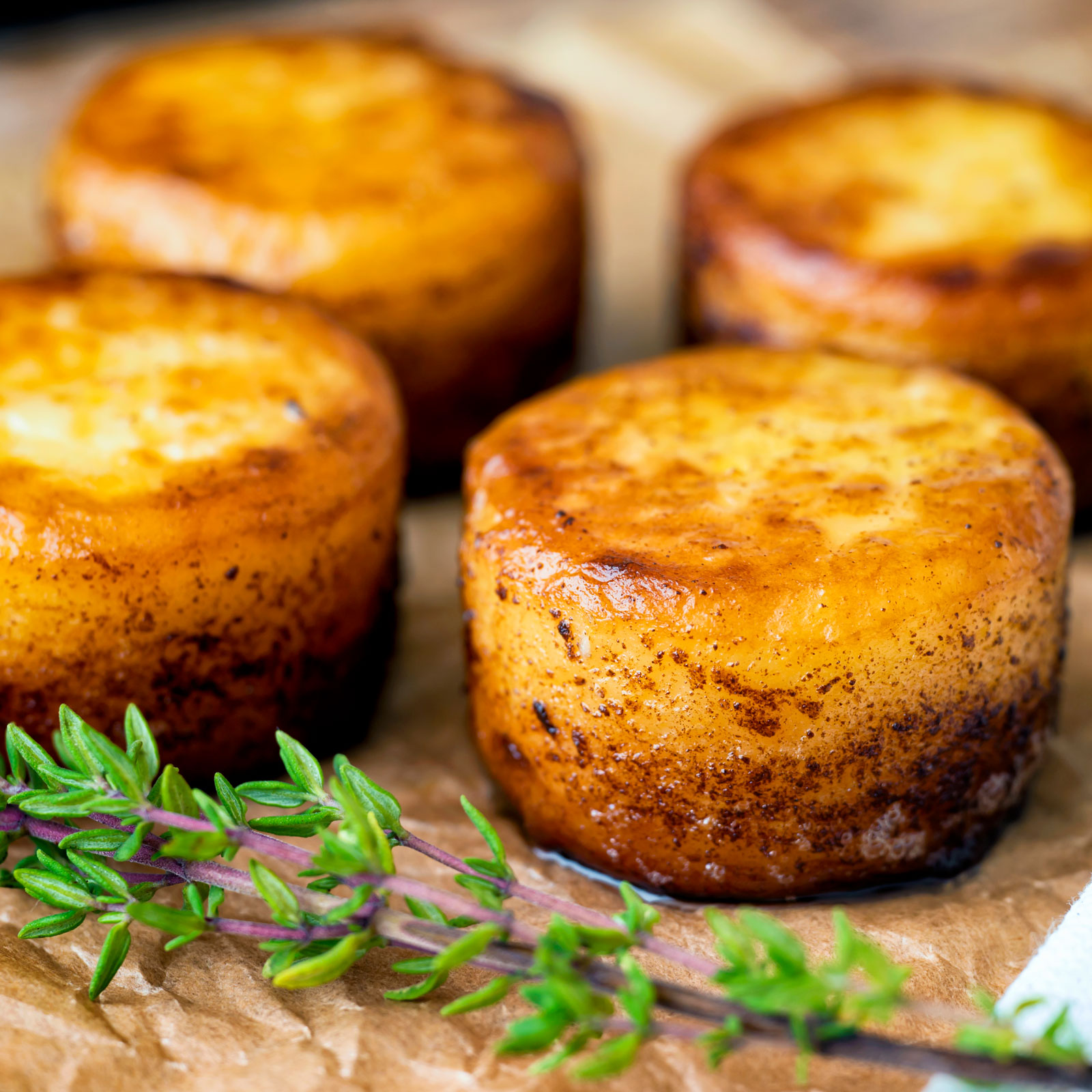 Easy fondant potatoes poached in butter and stock with a sprig of thyme.