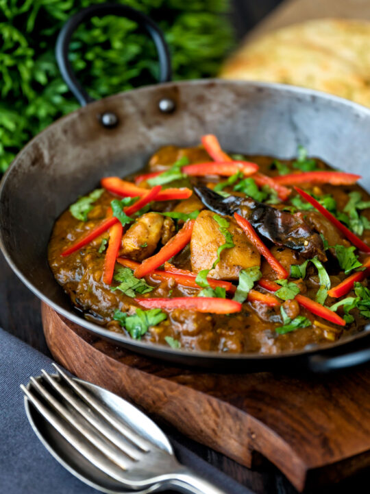 Garlic chilli chicken Indian style curry served with fresh chilli and coriander.