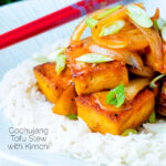 Vegan gochujang tofu stew with kimchi served with white rice featuring a title overlay.