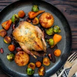 Miso roast Brussel sprouts served as part of a roast dinner.