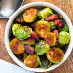 Overhead roast miso Brussel sprouts with bacon.