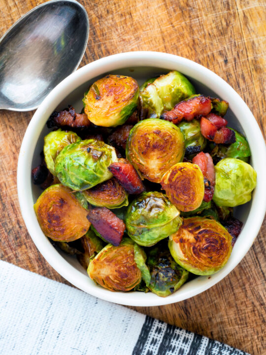 Overhead roast miso Brussel sprouts with bacon.