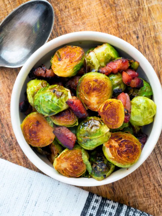 Overhead roast miso Brussel sprouts with bacon.