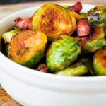 Close up roast miso Brussel sprouts with bacon.