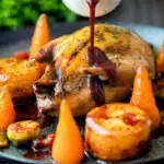 Red wine and red currant sauce poured over whole roast partridge featuring a title overlay.