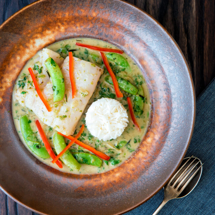 Thai green fish curry featuring cod, sugar snap peas and fresh red chilli peppers.