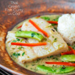 Close up Thai green fish curry made with cod and sugar snap peas featuring a title overlay.