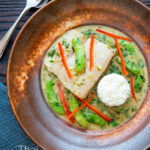 Overhead Thai green fish curry made with cod and sugar snap peas featuring a title overlay.