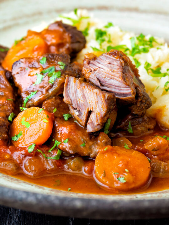 Moshari kokkinisto a Greek beef and tomato stew showing the texture of the beef.