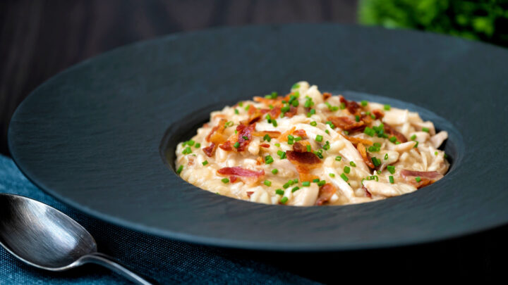 Creamy chicken and bacon risotto with snipped chives and crispy bacon.