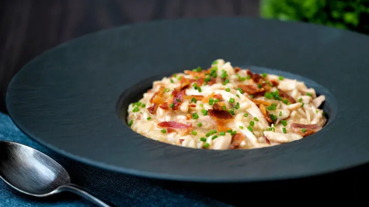 Creamy chicken and bacon risotto with snipped chives and crispy bacon.