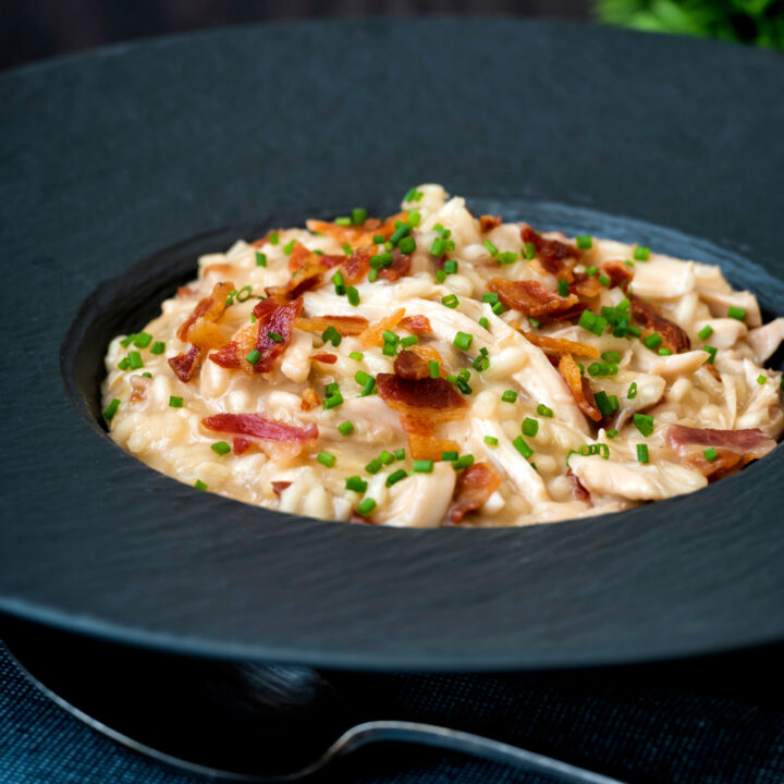 Creamy chicken and bacon risotto with snipped chives and crispy bacon.