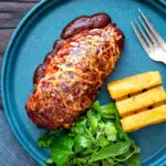 Overhead British pub favourite hunters chicken with BBQ sauce, cheddar cheese and bacon.