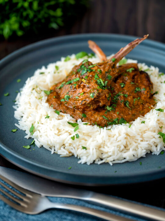 Indian inspired lamb chop curry served with rice and coriander.
