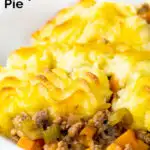 Minced lamb shepherds pie served in a white bowl featuring a title overlay.