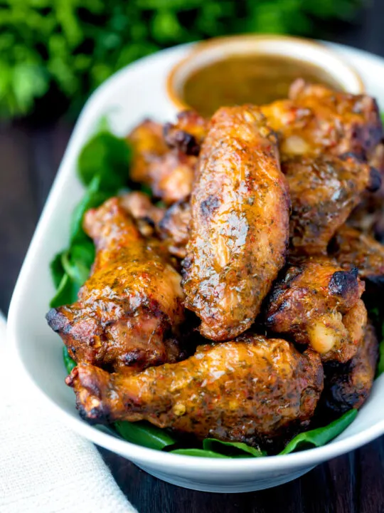 Spicy mango habanero hot wings served with extra dipping sauce.