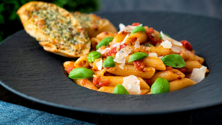 Classic penne arrabbiata served with basil, parmesan, black pepper and cheesy garlic bread.