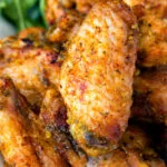 Close up pineapple and jalapeno pepper glazed chicken wings.