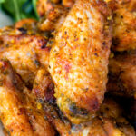 Close up pineapple and jalapeno pepper glazed chicken wings featuring a title overlay.