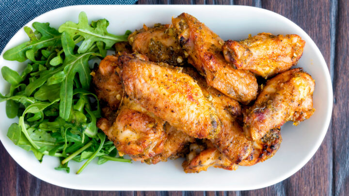 Pineapple and jalapeno pepper glazed chicken wings served with arugula.