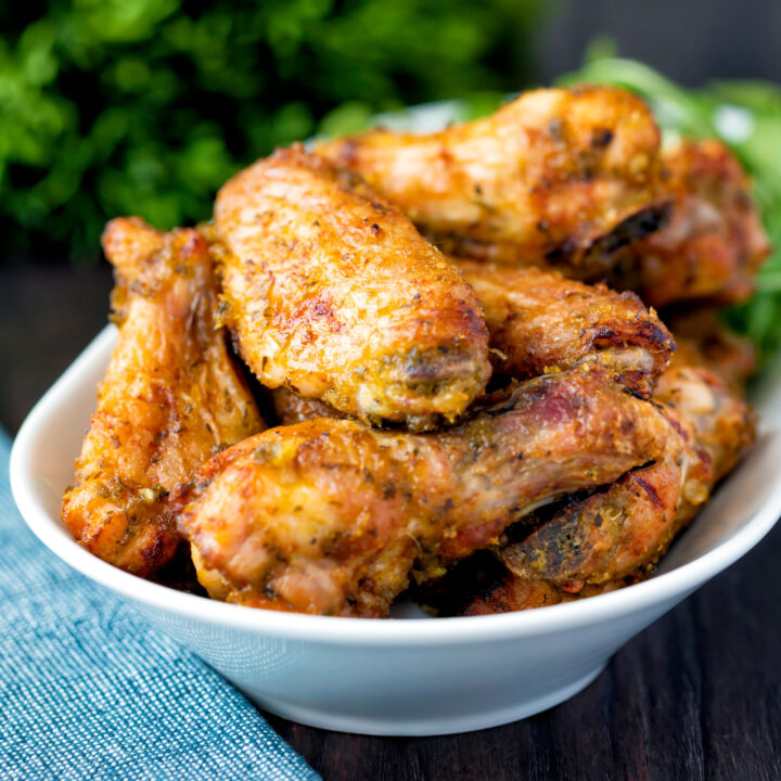 Pineapple and jalapeno pepper glazed chicken wings served with arugula.