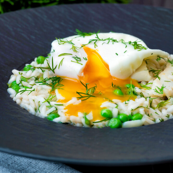 Smoked haddock risotto with peas topped with a poached egg with a runny yolk.