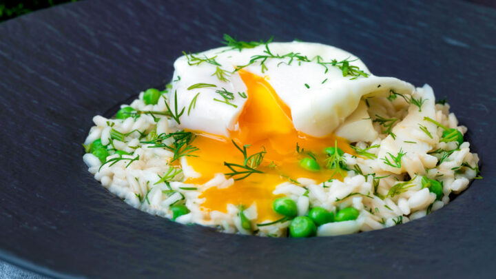 Smoked haddock risotto with peas topped with a poached egg with a runny yolk.