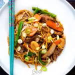 Overhead homemade Chinese beef chow mein fakeaway featuring a title overlay.