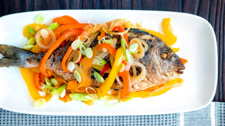 Jamaican influenced escovitch fish with whole sea bream and "pickled" peppers and onions.