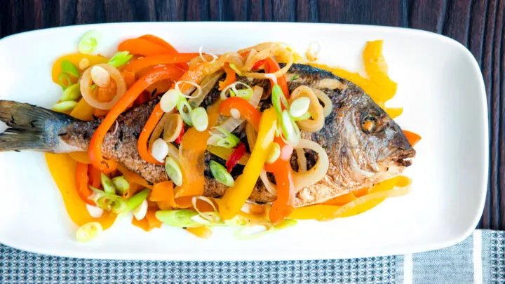 Jamaican influenced escovitch fish with whole sea bream and "pickled" peppers and onions.