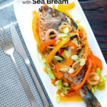 Overhead Jamaican influenced escovitch fish with sea bream and "pickled" peppers and onions featuring a title overlay.