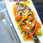 Overhead Jamaican influenced escovitch fish with sea bream and "pickled" peppers and onions featuring a title overlay.
