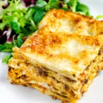 Classic Lasagna bolognese, baked to perfection served with a side salad.