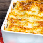 Classic Lasagna Bolognese, baked to perfection in a baking dish with a crispy cheesy topping.