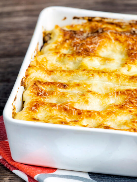 Classic Lasagna Bolognese, baked to perfection in a baking dish with a crispy cheesy topping.