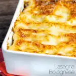 Classic Lasagna Bolognese, baked to perfection in a baking dish with a crispy cheesy topping featuring a title overlay.