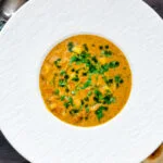 Overhead chicken mulligatawny soup with coconut milk.