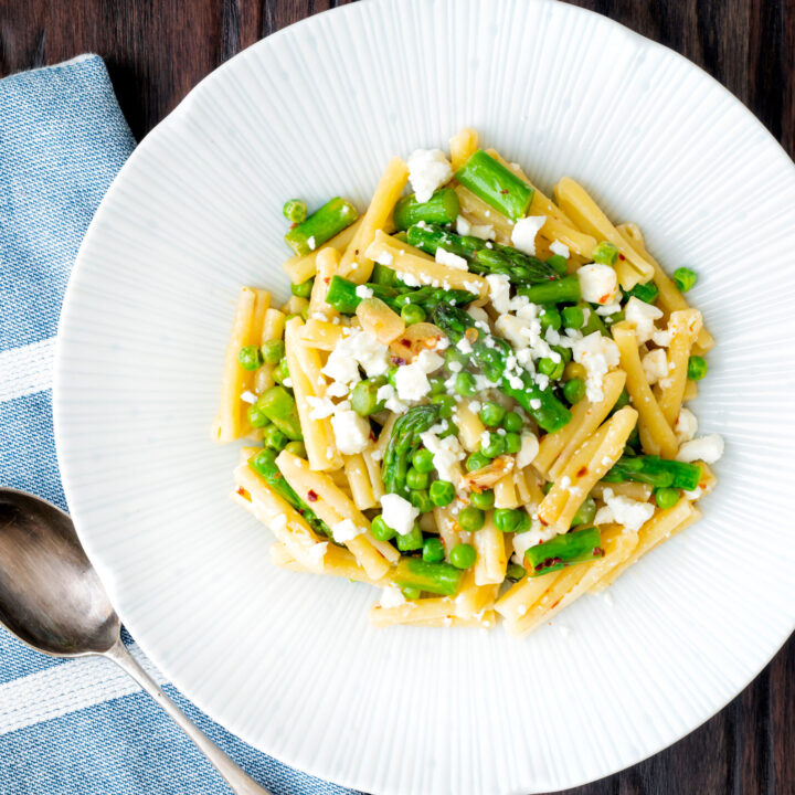 Pea and asparagus pasta with casarecce, lemon, feta cheese and chilli flakes.