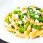 Pea and asparagus pasta with casarecce, feta cheese and chilli flakes.