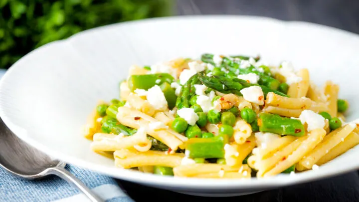 Pea and asparagus pasta with casarecce, lemon, feta cheese and chilli flakes.