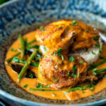 Pheasant curry with coconut milk, green beans and rice.