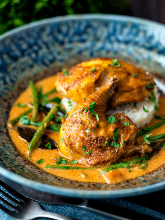 Pheasant curry with coconut milk, green beans and rice.