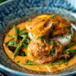 Pheasant curry with coconut milk, green beans and rice featuring a title overlay.