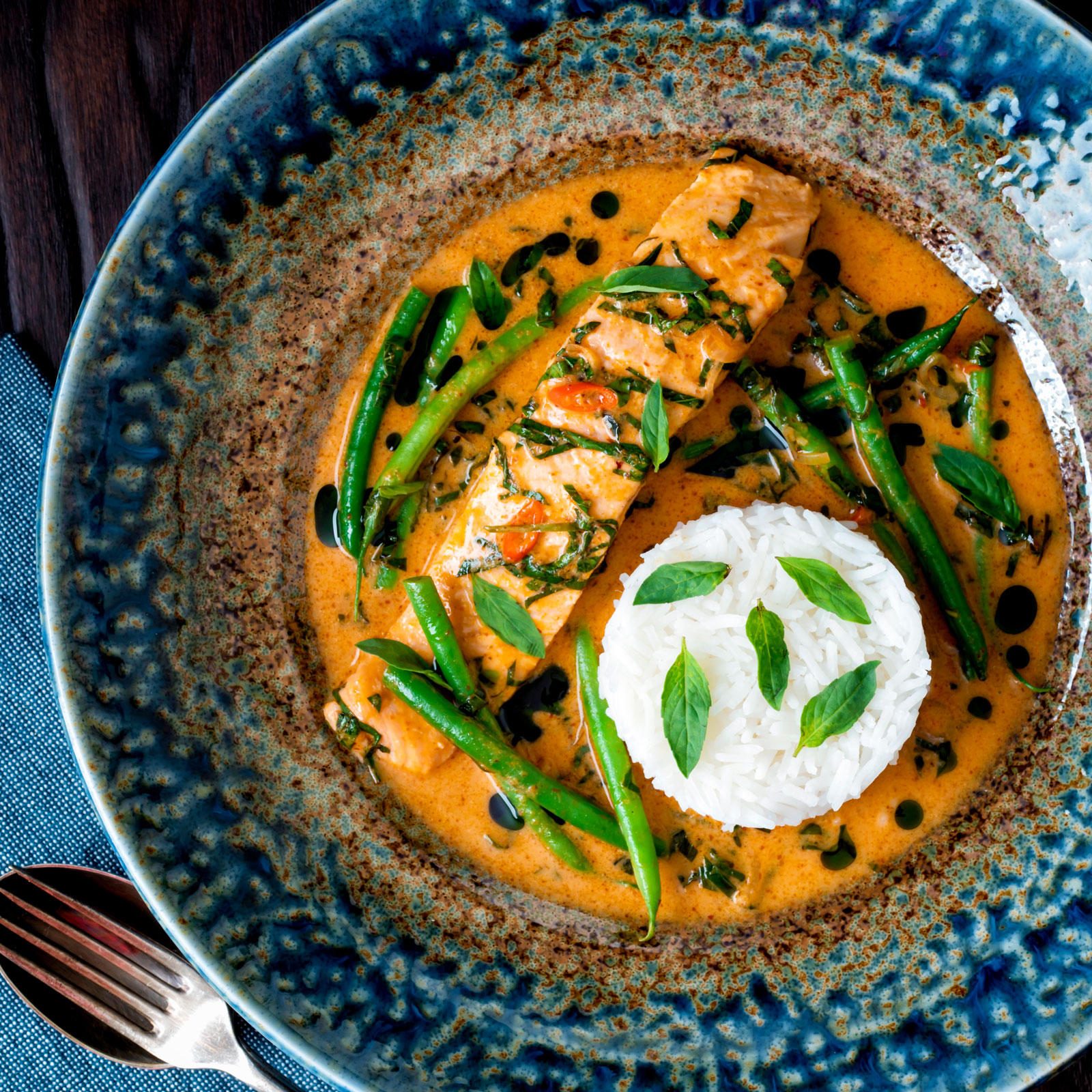 Red Thai salmon curry with green beans, Thai basil and jasmine rice.