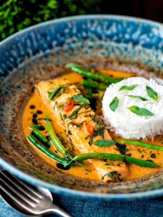 Red Thai salmon curry with green beans and jasmine rice.