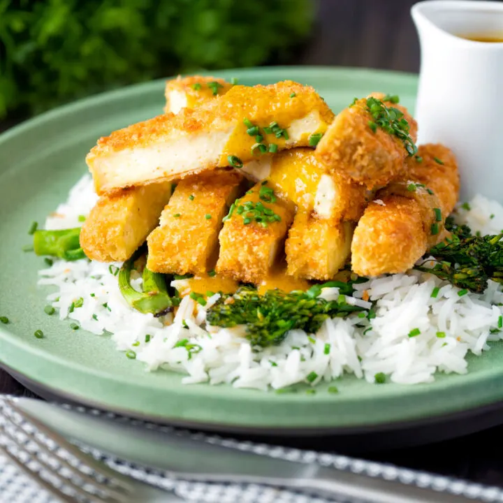 Vegetarian Japanese influenced tofu katsu curry with a homemade sauce, rice and broccoli.