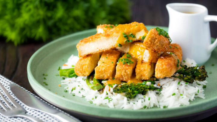 Vegetarian Japanese influenced tofu katsu curry with a homemade sauce, rice and broccoli.