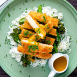 Overhead tofu katsu curry with a homemade sauce, rice and soy roasted tenderstem broccoli.