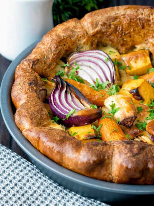 Close up roasted vegetable toad in the hole.